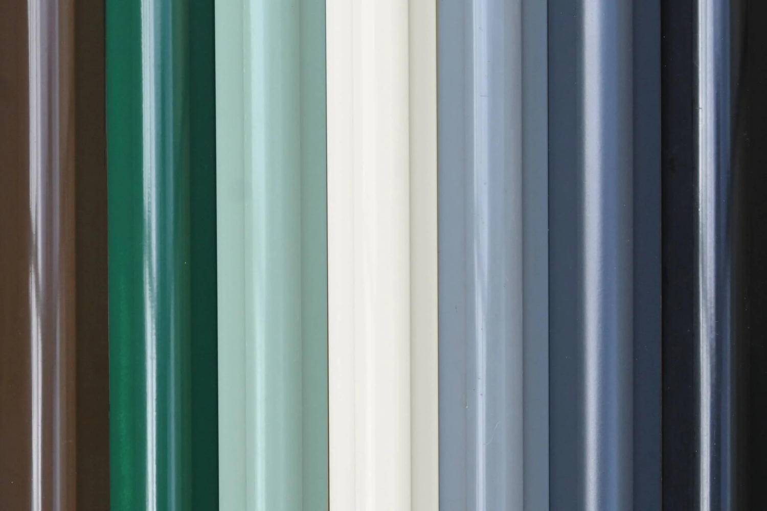 Image showing the metal colour coating options, the colours are all laid next to each other showing the options available. Colours from left to right are: Chestnut Brown, Racing Green, Cotswold Green, Antique Ivory, Smokey Grey, Anthracite &amp; Black