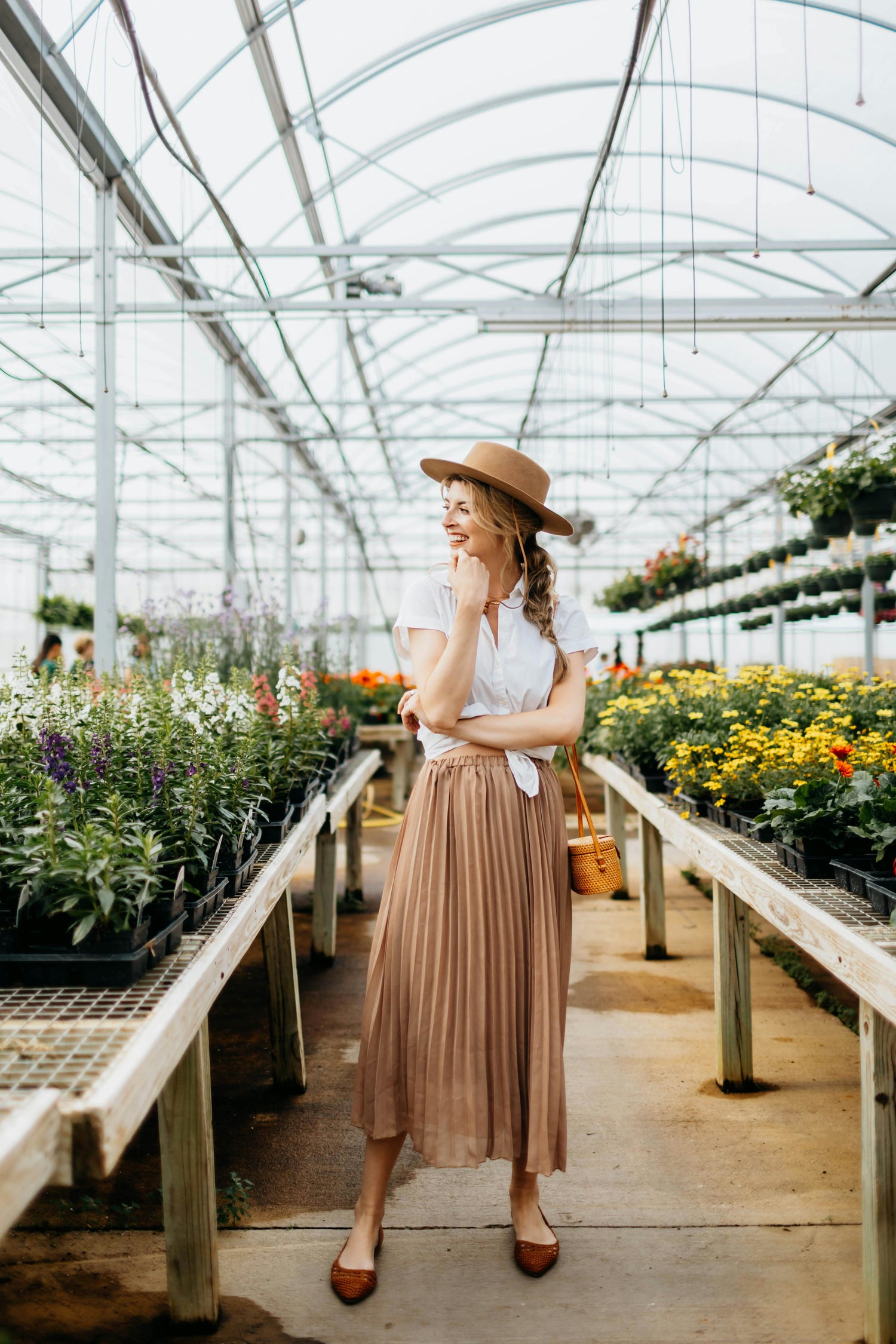 Photo by Leah Newhouse: https://www.pexels.com/photo/woman-in-white-shirt-and-brown-hat-standing-in-the-flower-shop-8050552/